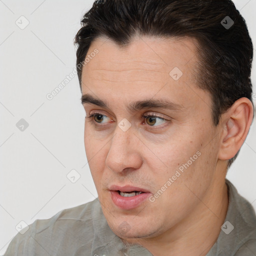 Joyful white adult male with short  brown hair and brown eyes