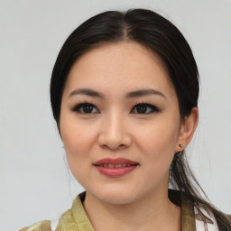 Joyful asian young-adult female with medium  brown hair and brown eyes