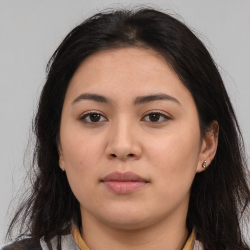Neutral latino young-adult female with long  brown hair and brown eyes