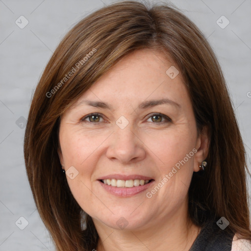 Joyful white adult female with medium  brown hair and grey eyes