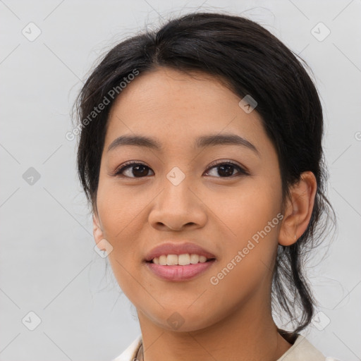 Joyful asian young-adult female with medium  black hair and brown eyes