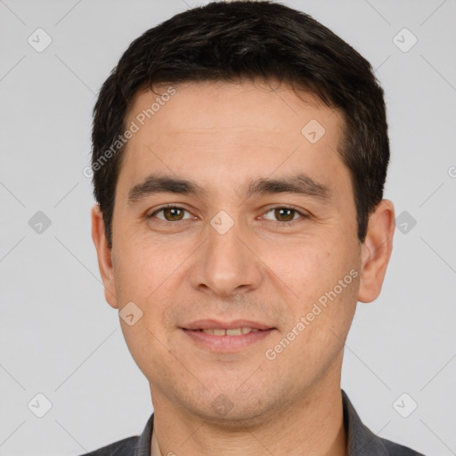 Joyful white young-adult male with short  black hair and brown eyes