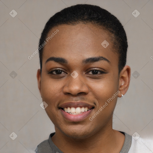 Joyful black young-adult female with short  black hair and brown eyes