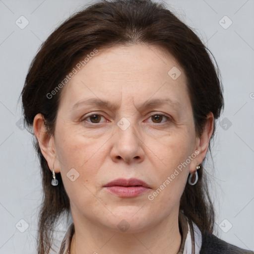 Joyful white adult female with medium  brown hair and grey eyes