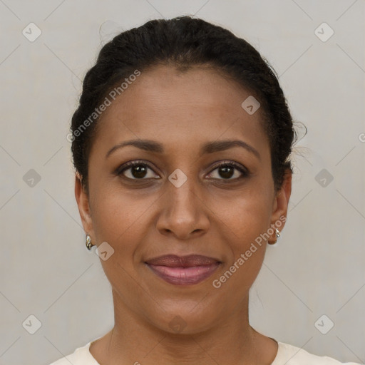 Joyful black adult female with short  brown hair and brown eyes