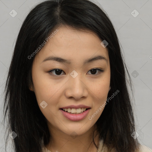 Joyful asian young-adult female with long  brown hair and brown eyes