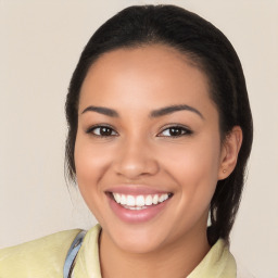 Joyful latino young-adult female with long  black hair and brown eyes