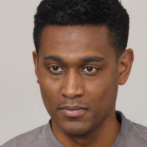 Neutral black young-adult male with short  black hair and brown eyes
