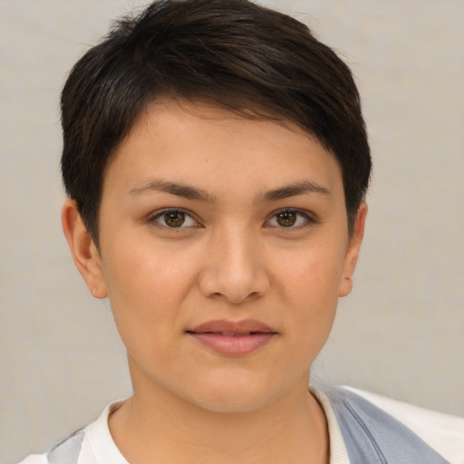 Joyful white young-adult female with short  brown hair and brown eyes