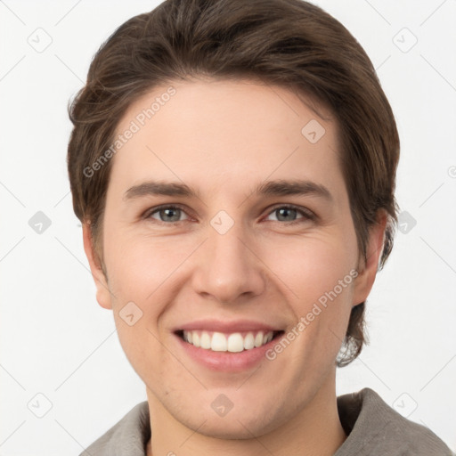 Joyful white young-adult female with short  brown hair and grey eyes