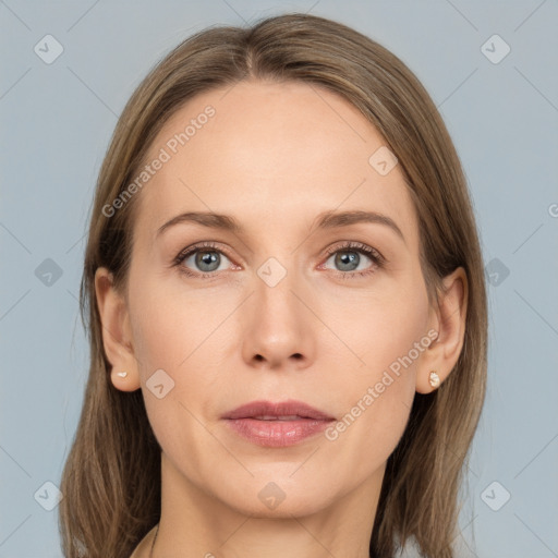 Joyful white adult female with medium  brown hair and grey eyes