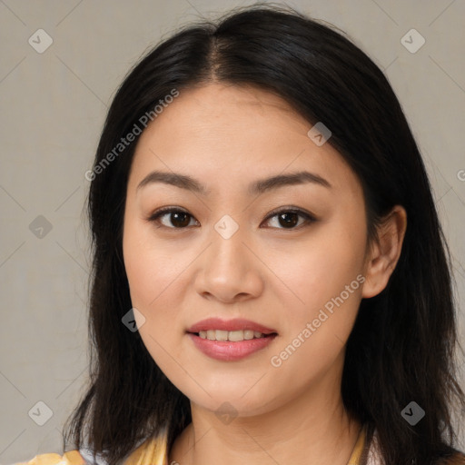 Joyful asian young-adult female with long  brown hair and brown eyes