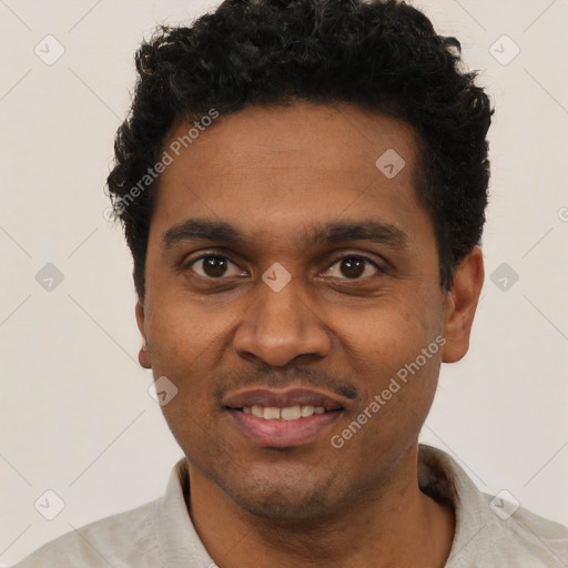 Joyful black young-adult male with short  black hair and brown eyes