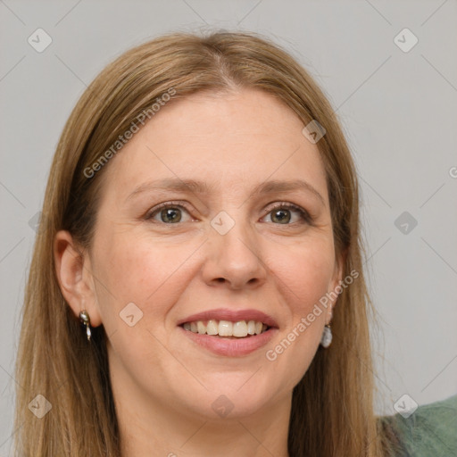 Joyful white adult female with long  brown hair and grey eyes