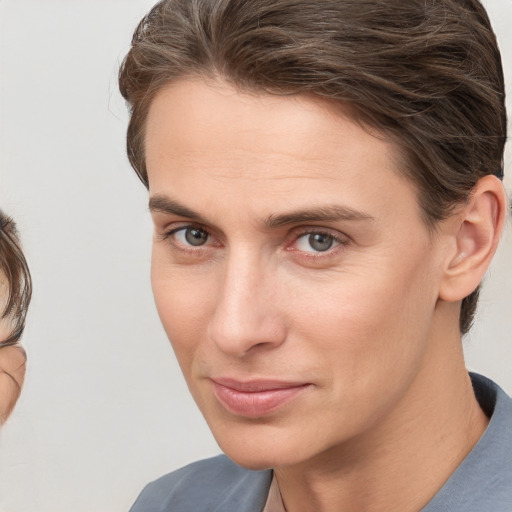 Joyful white young-adult male with medium  brown hair and brown eyes