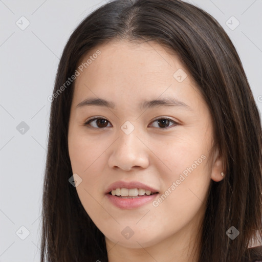 Joyful asian young-adult female with long  brown hair and brown eyes