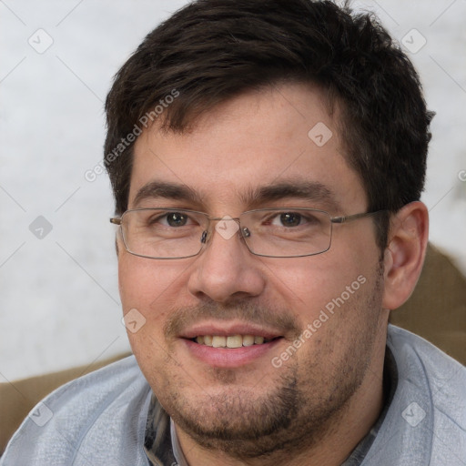 Joyful white adult male with short  brown hair and brown eyes