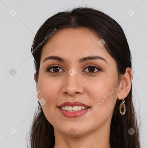 Joyful white young-adult female with long  brown hair and brown eyes