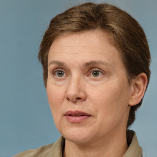 Joyful white adult female with short  brown hair and brown eyes