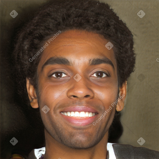 Joyful black young-adult male with short  brown hair and brown eyes