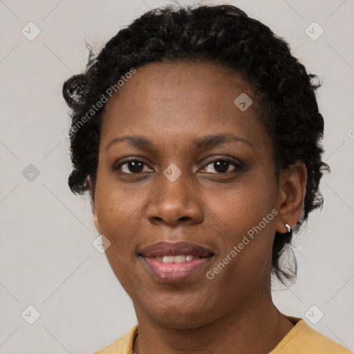 Joyful black adult female with short  brown hair and brown eyes