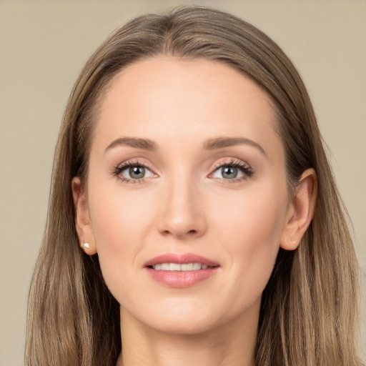 Joyful white young-adult female with long  brown hair and grey eyes