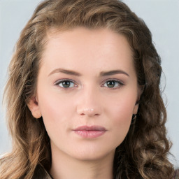 Neutral white young-adult female with long  brown hair and green eyes