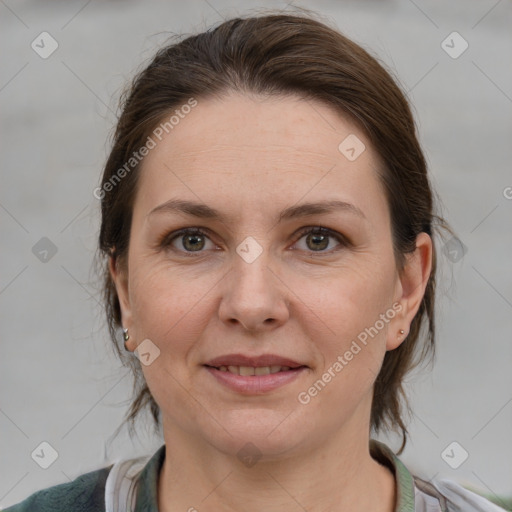 Joyful white adult female with medium  brown hair and grey eyes