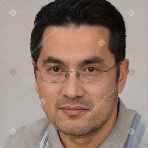 Joyful white adult male with short  black hair and brown eyes