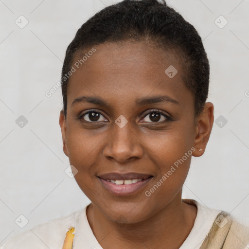 Joyful black young-adult female with short  brown hair and brown eyes