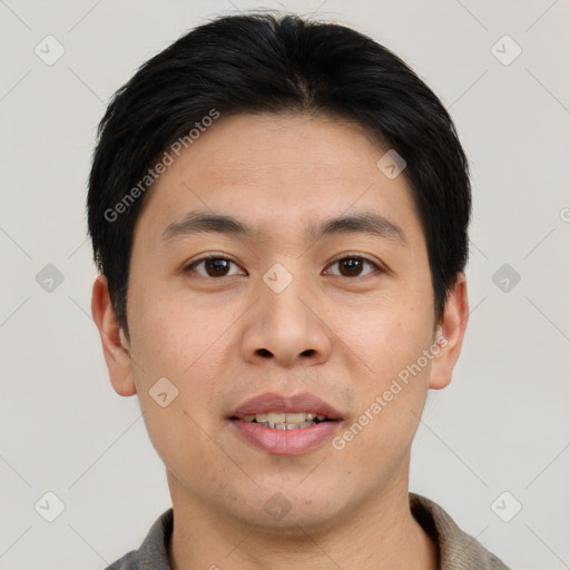 Joyful asian young-adult male with short  brown hair and brown eyes