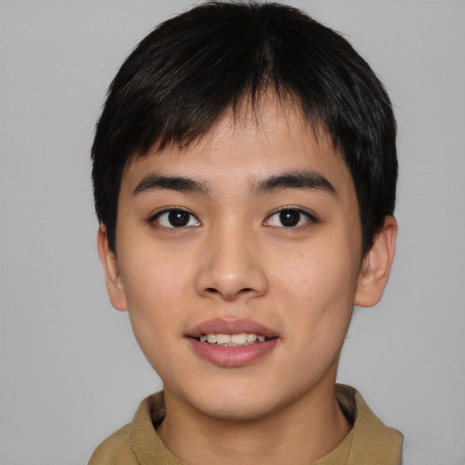 Joyful asian young-adult male with short  black hair and brown eyes