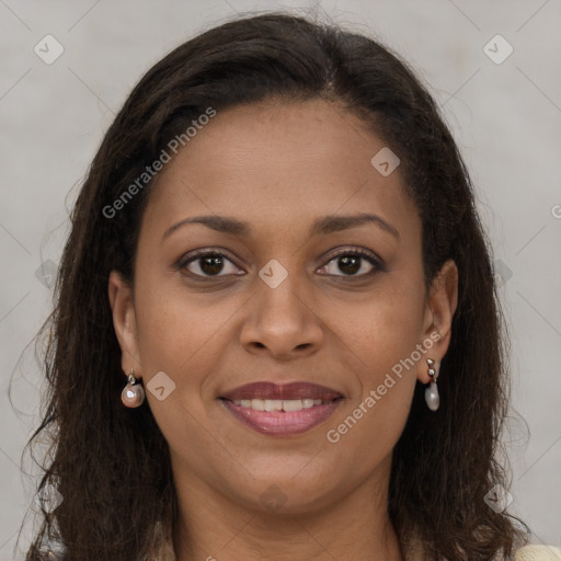 Joyful black young-adult female with long  brown hair and brown eyes