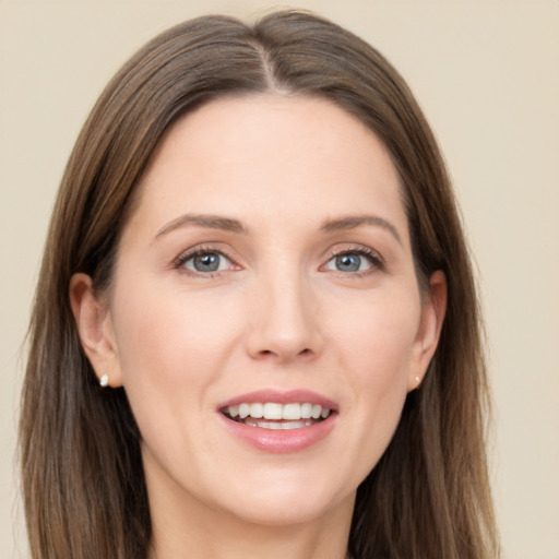 Joyful white young-adult female with long  brown hair and grey eyes