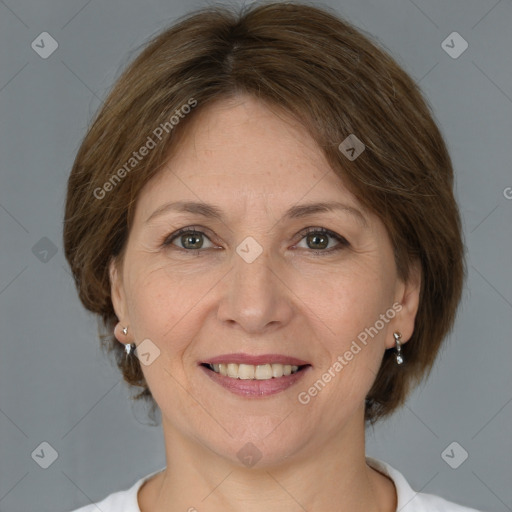 Joyful white adult female with medium  brown hair and brown eyes