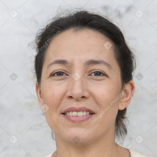 Joyful white adult female with short  brown hair and brown eyes