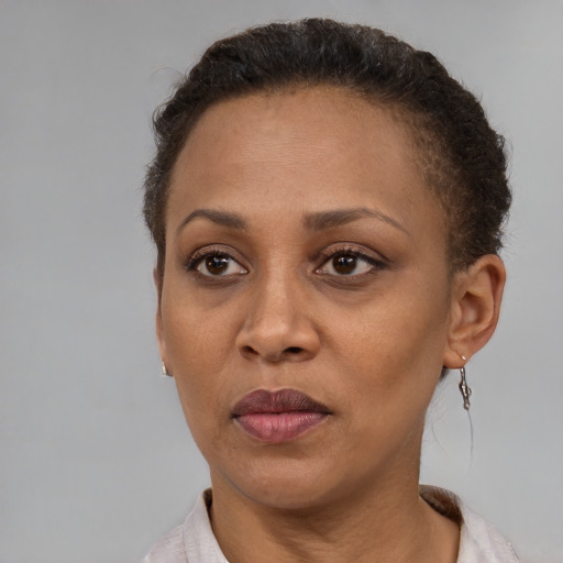 Neutral black adult female with short  brown hair and brown eyes