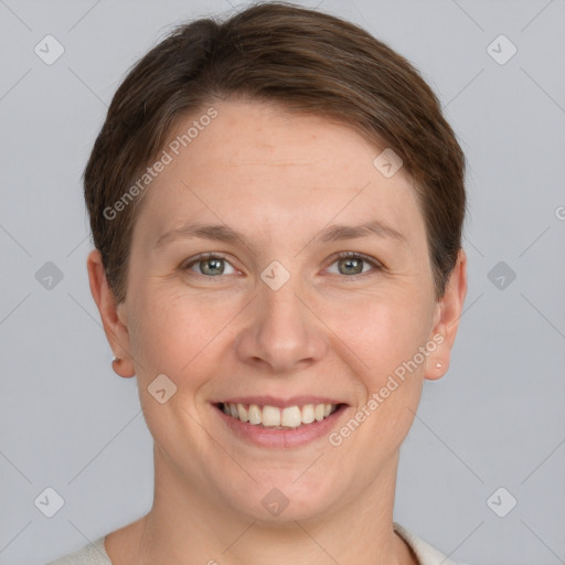 Joyful white young-adult female with short  brown hair and grey eyes