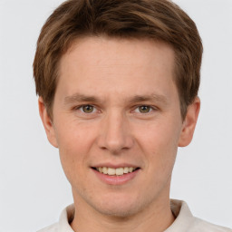 Joyful white adult male with short  brown hair and grey eyes