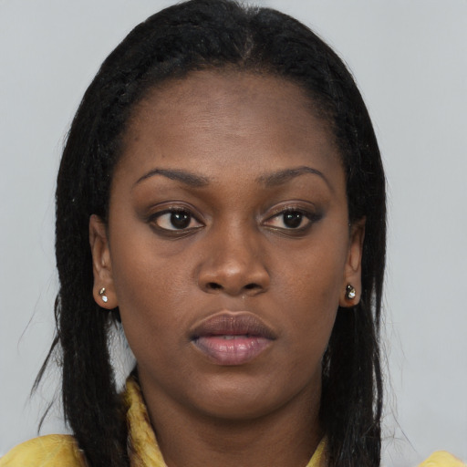 Neutral black young-adult female with long  brown hair and brown eyes