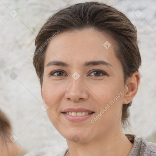 Joyful white adult female with short  brown hair and brown eyes