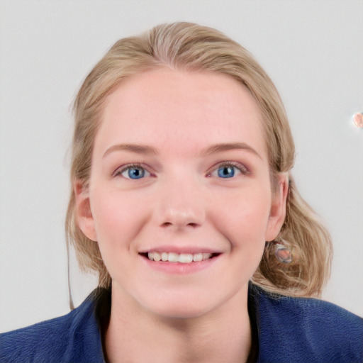 Joyful white child female with medium  brown hair and blue eyes