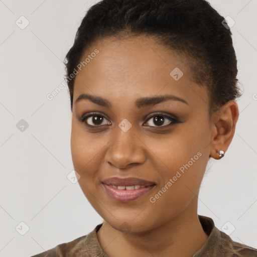 Joyful black young-adult female with short  brown hair and brown eyes