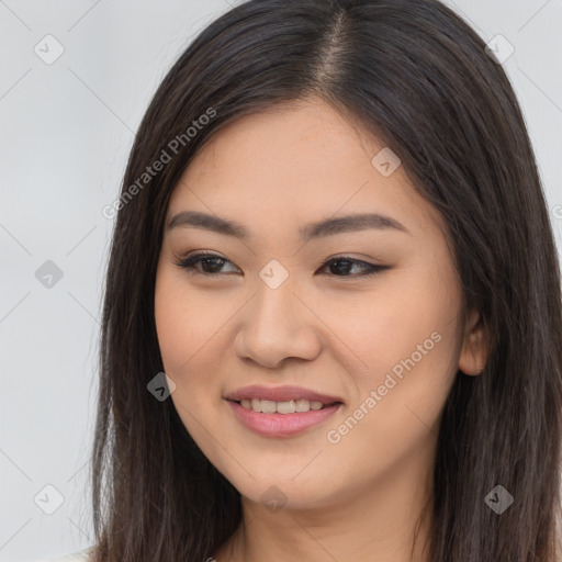 Joyful asian young-adult female with long  brown hair and brown eyes