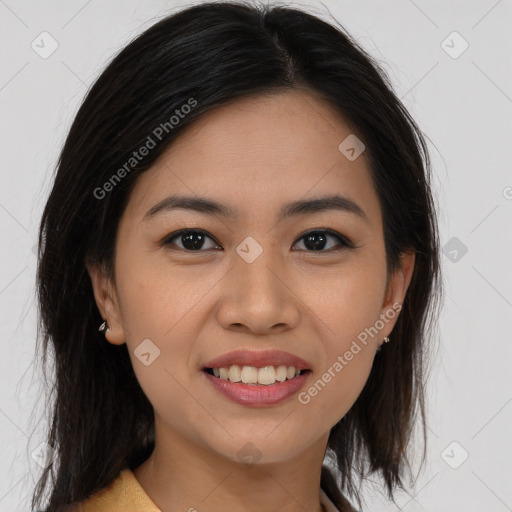 Joyful asian young-adult female with long  brown hair and brown eyes