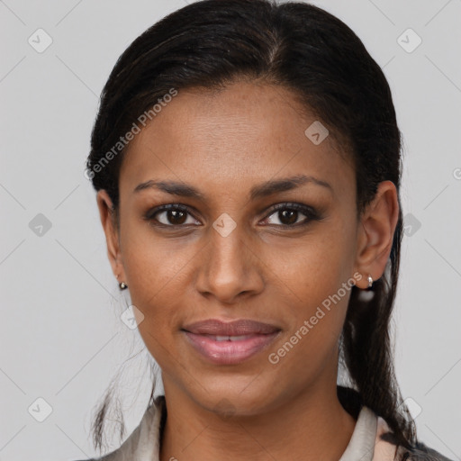 Joyful black young-adult female with medium  brown hair and brown eyes