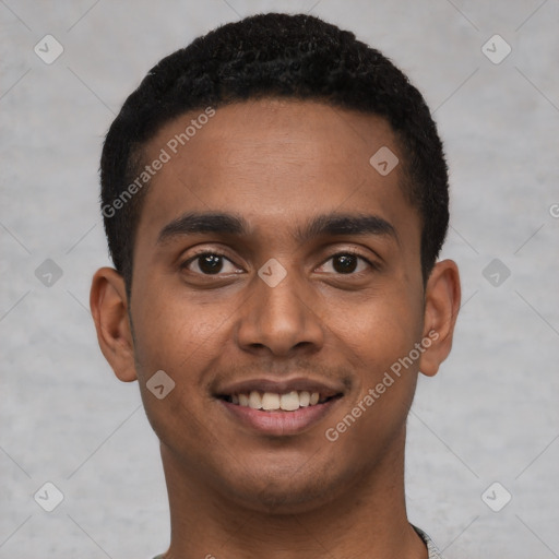 Joyful black young-adult male with short  black hair and brown eyes