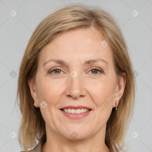 Joyful white adult female with medium  brown hair and grey eyes