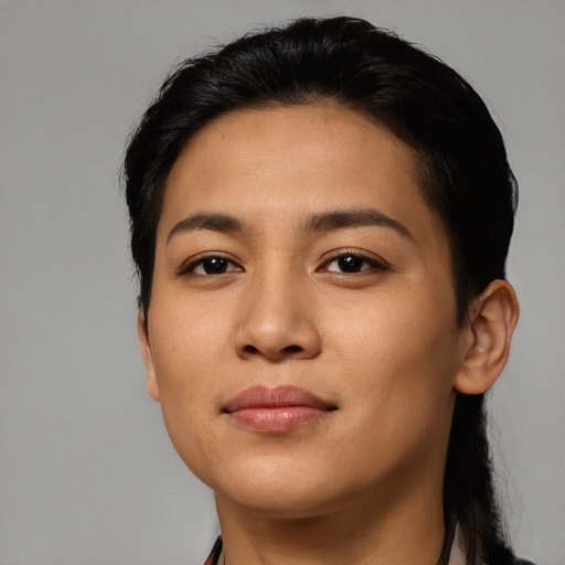 Joyful latino young-adult female with medium  black hair and brown eyes
