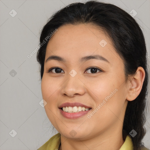 Joyful asian young-adult female with medium  brown hair and brown eyes